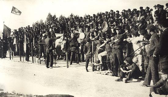 Bosung College students cheering during a football game with Ilin College